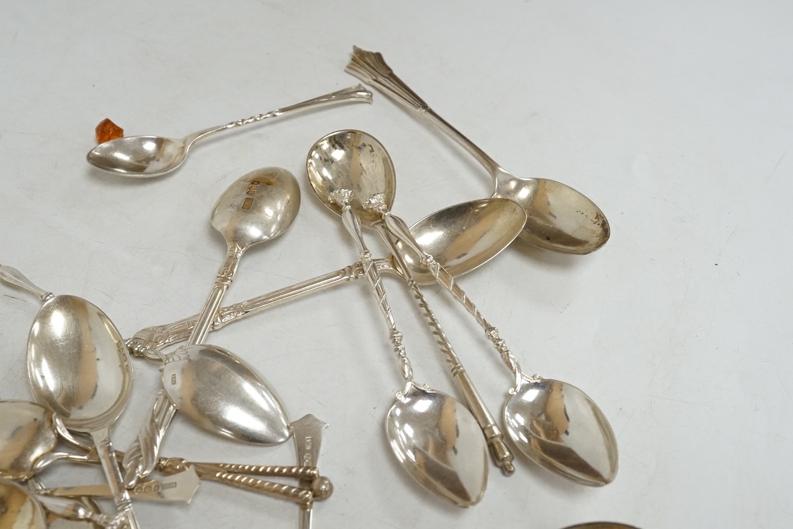 A group of assorted silver and white metal tea and coffee spoons and a pair of silver sugar tongs, weighable hallmarked silver 8.6oz.